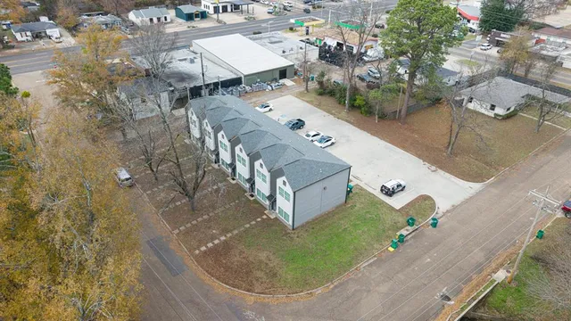 an aerial view of a house with outdoor space