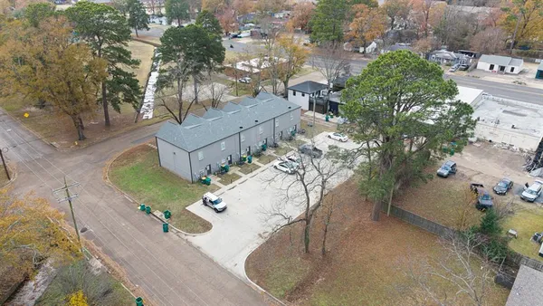 an aerial view of a house with a yard