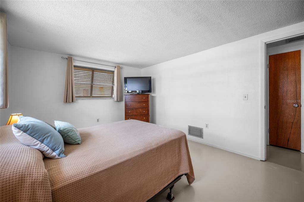 901 Ponderosa Road Venice, FL 34293 - Photo 12 of 33 a bedroom with a bed and a closet