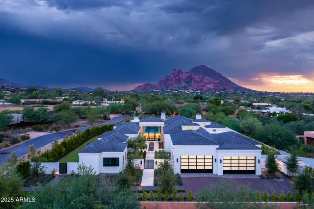 an aerial view of residential houses and outdoor space