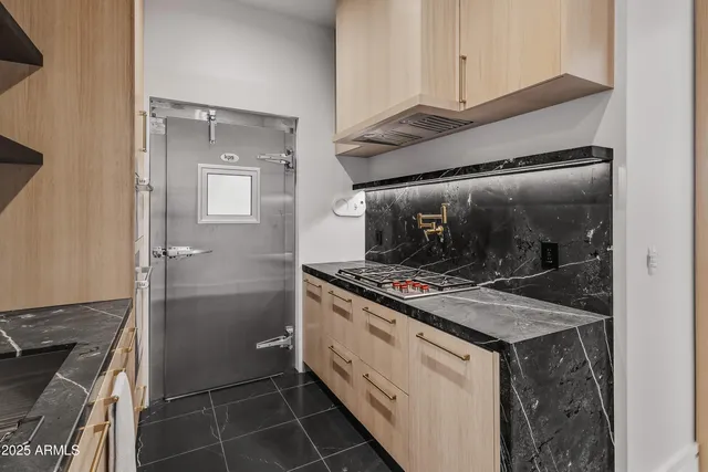 a dining room with furniture a chandelier and window