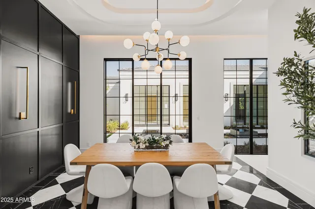 a living room with furniture large window and a fireplace