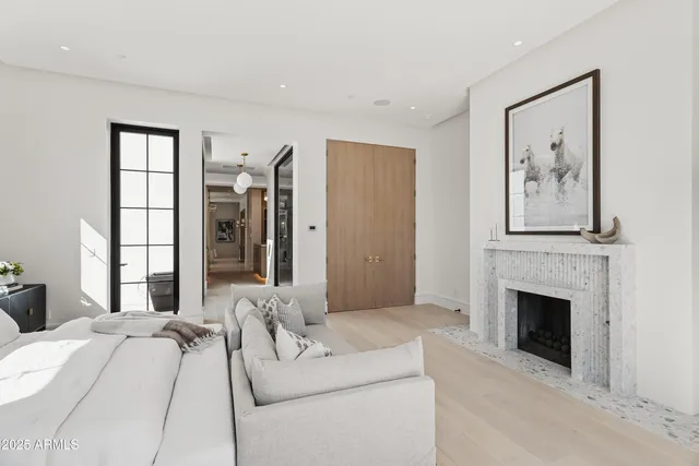 a large white kitchen with a large window