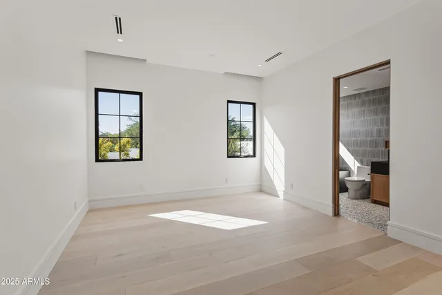 a bedroom with furniture and a window