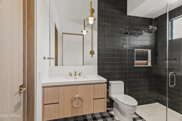 a bathroom with a window and a shower