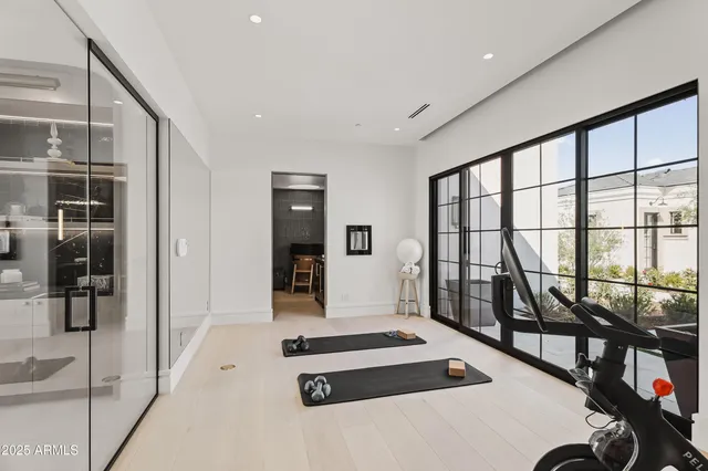 a bathroom with a sink toilet a mirror and shower