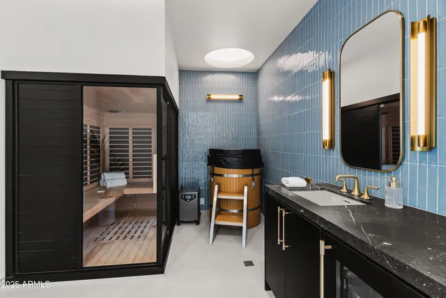 a living room with furniture a chandelier and a fireplace