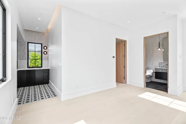 a kitchen with stainless steel appliances granite countertop a sink and a stove