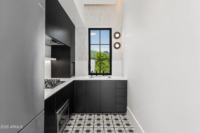 a dining room with furniture and chandelier