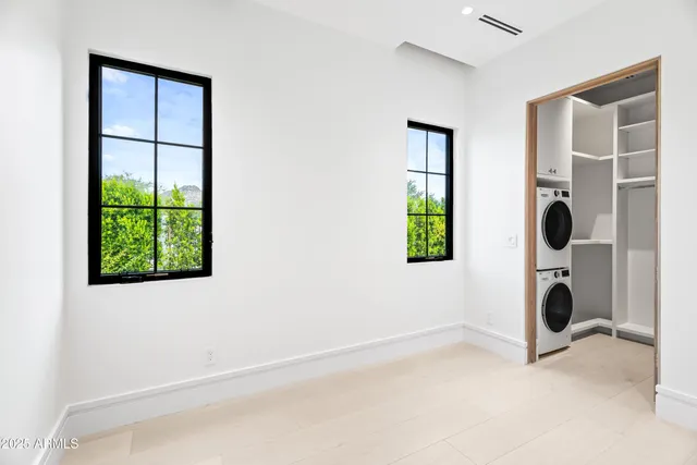a living room with furniture fireplace and window