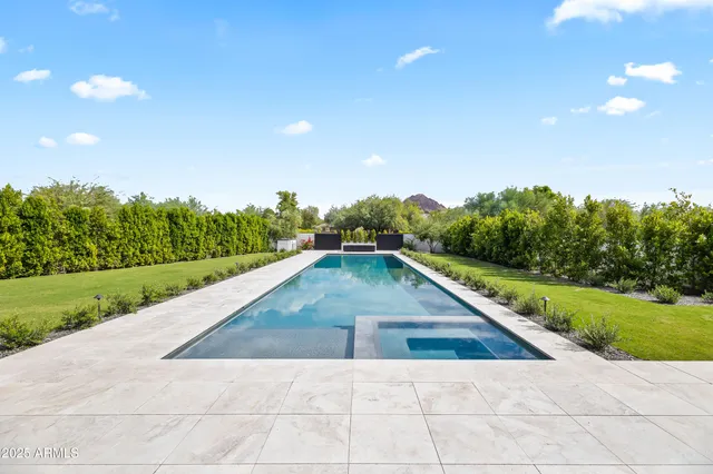 a view of a living room and kitchen with a large window