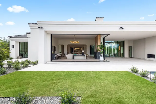 a view of swimming pool with sitting area