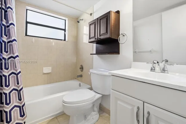 a bathroom with a sink a toilet and bathtub