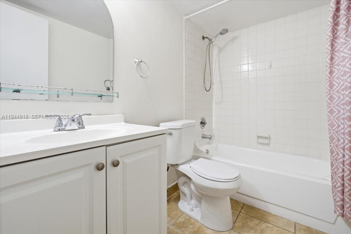 14861 Southwest 104th Street, Unit 2813 Miami, FL 33196 - Photo 19 of 21 a bathroom with a sink toilet and shower