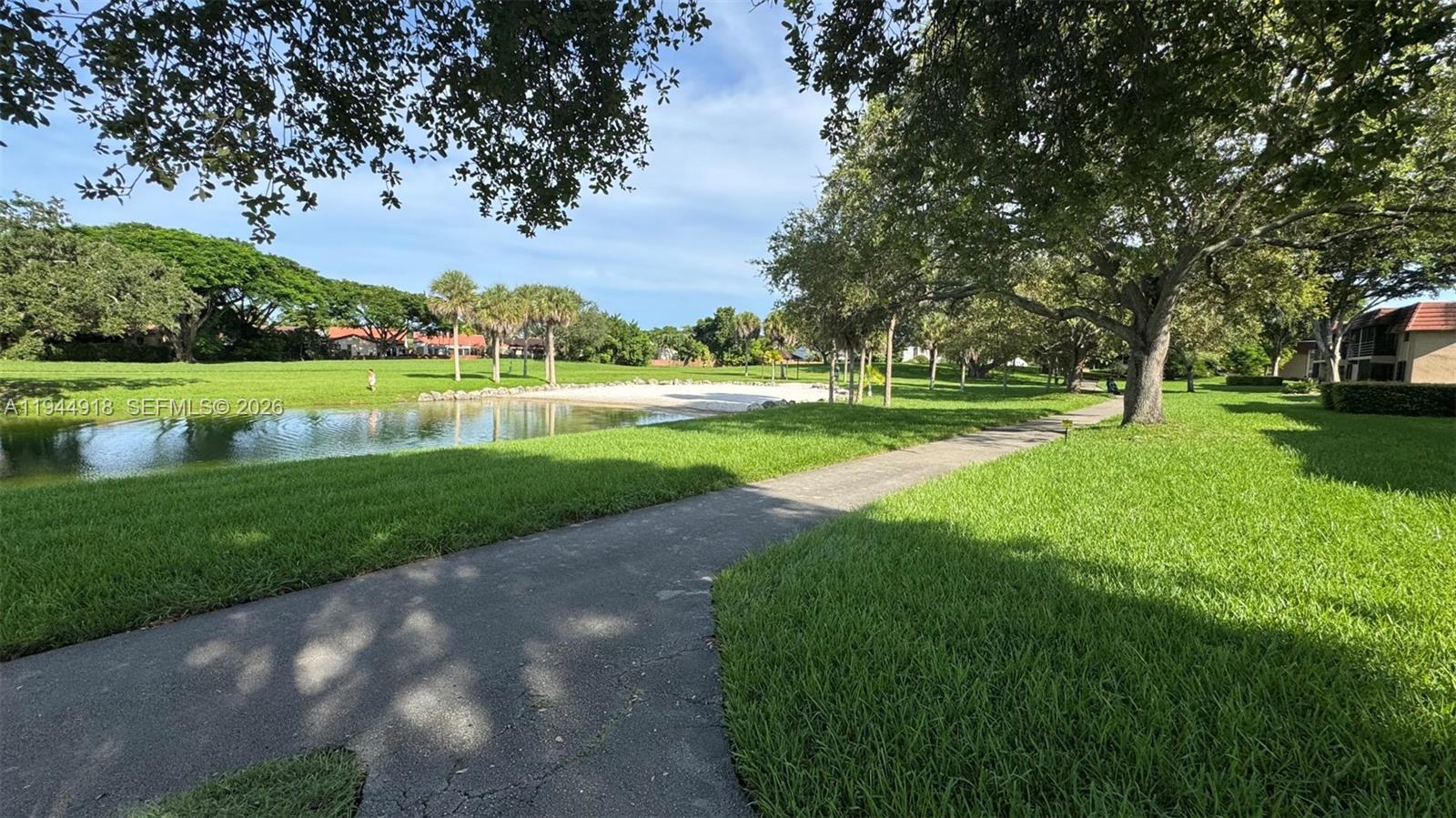 14861 Southwest 104th Street, Unit 2813 Miami, FL 33196 - Photo 20 of 21 a view of a park and trees in the background