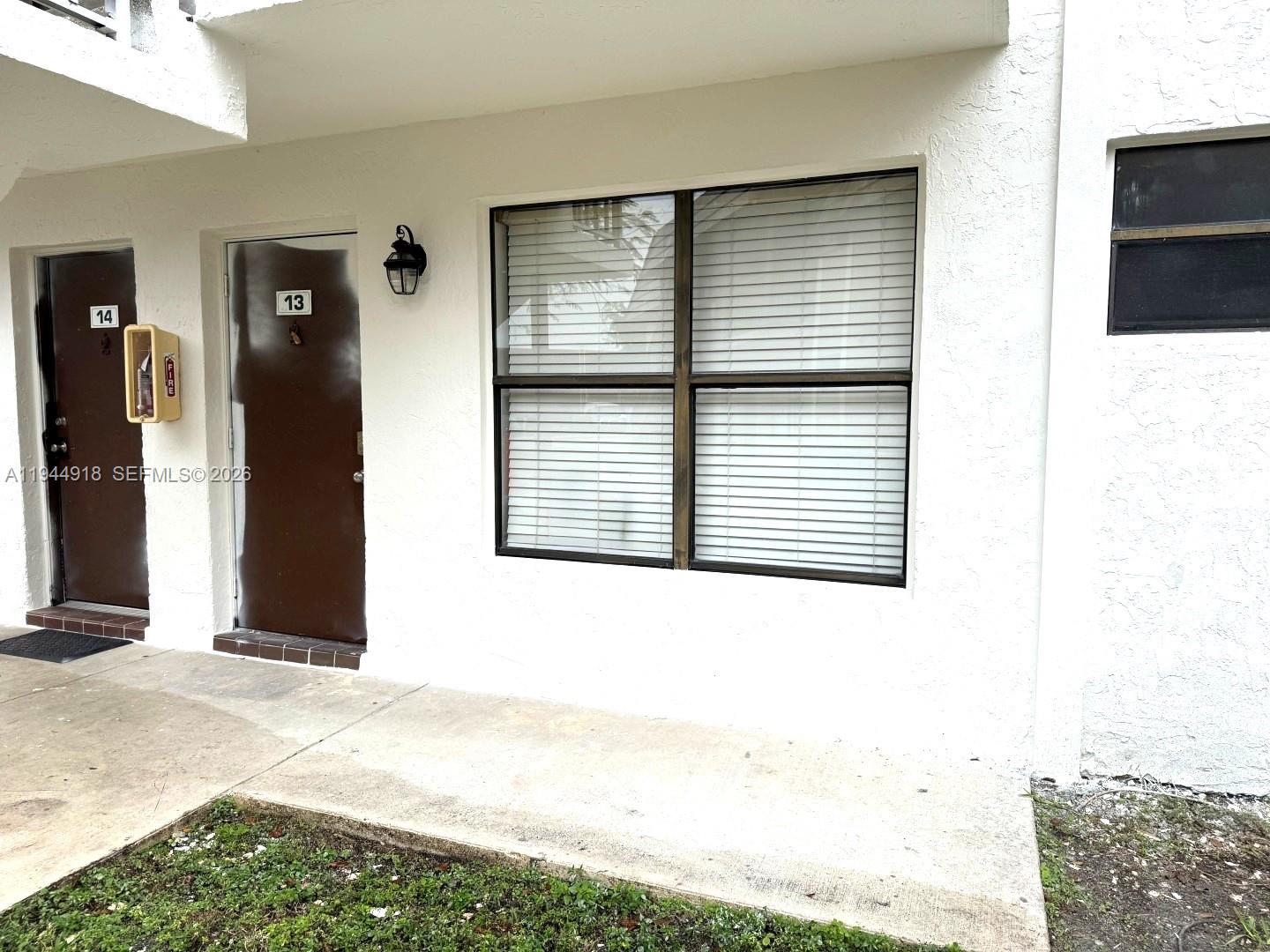 14861 Southwest 104th Street, Unit 2813 Miami, FL 33196 - Photo 2 of 21 a view of a bedroom with a large window