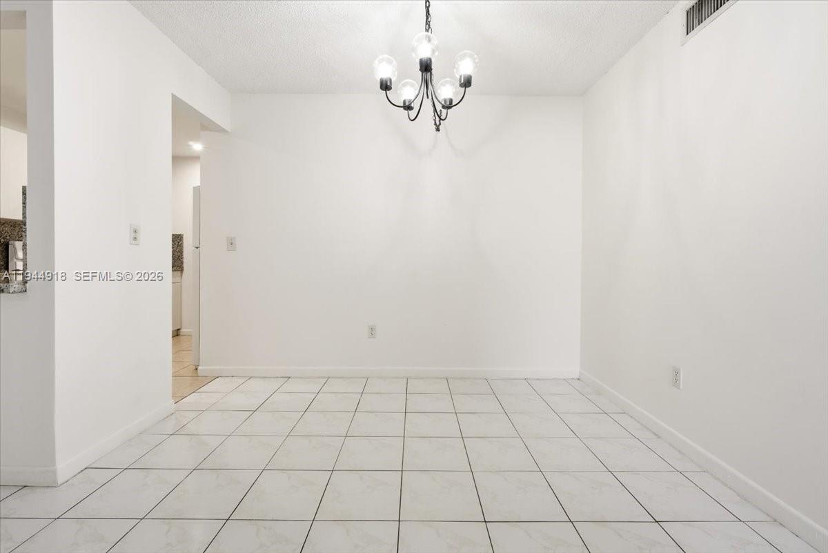 14861 Southwest 104th Street, Unit 2813 Miami, FL 33196 - Photo 7 of 21 a view of an empty room