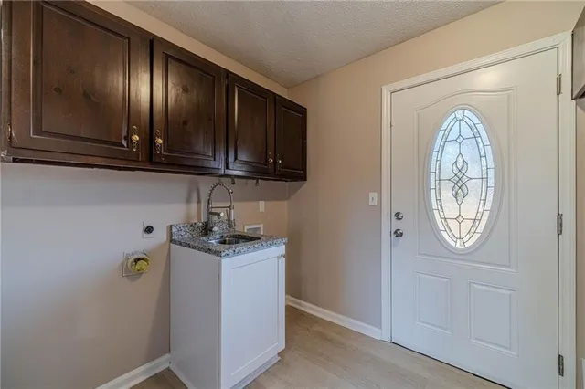 a view of a storage and utility room in a kitchen