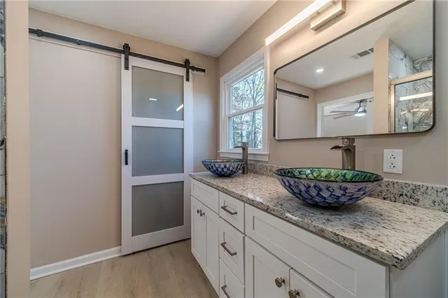a kitchen with a sink and cabinets