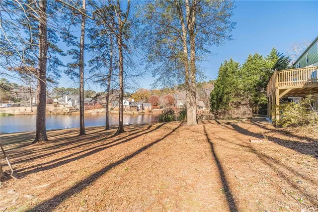 a view of a house with a yard covered in snow