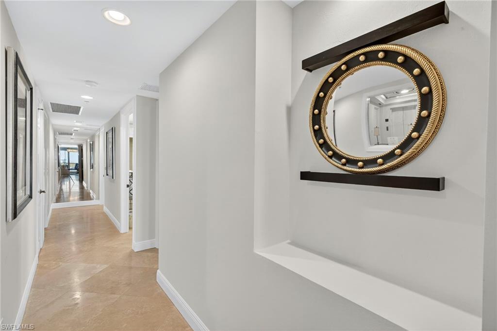 285 Grande Way, Unit 705 Naples, FL 34110 - Photo 19 of 44 Hallway to two guest bedrooms & bathrooms