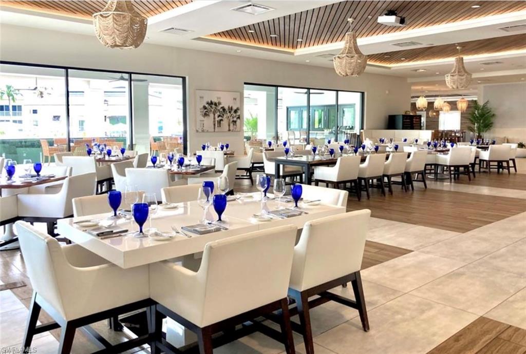 285 Grande Way, Unit 705 Naples, FL 34110 - Photo 41 of 44 Dining space with wood ceiling, hardwood / wood-style flooring, and a healthy amount of sunlight