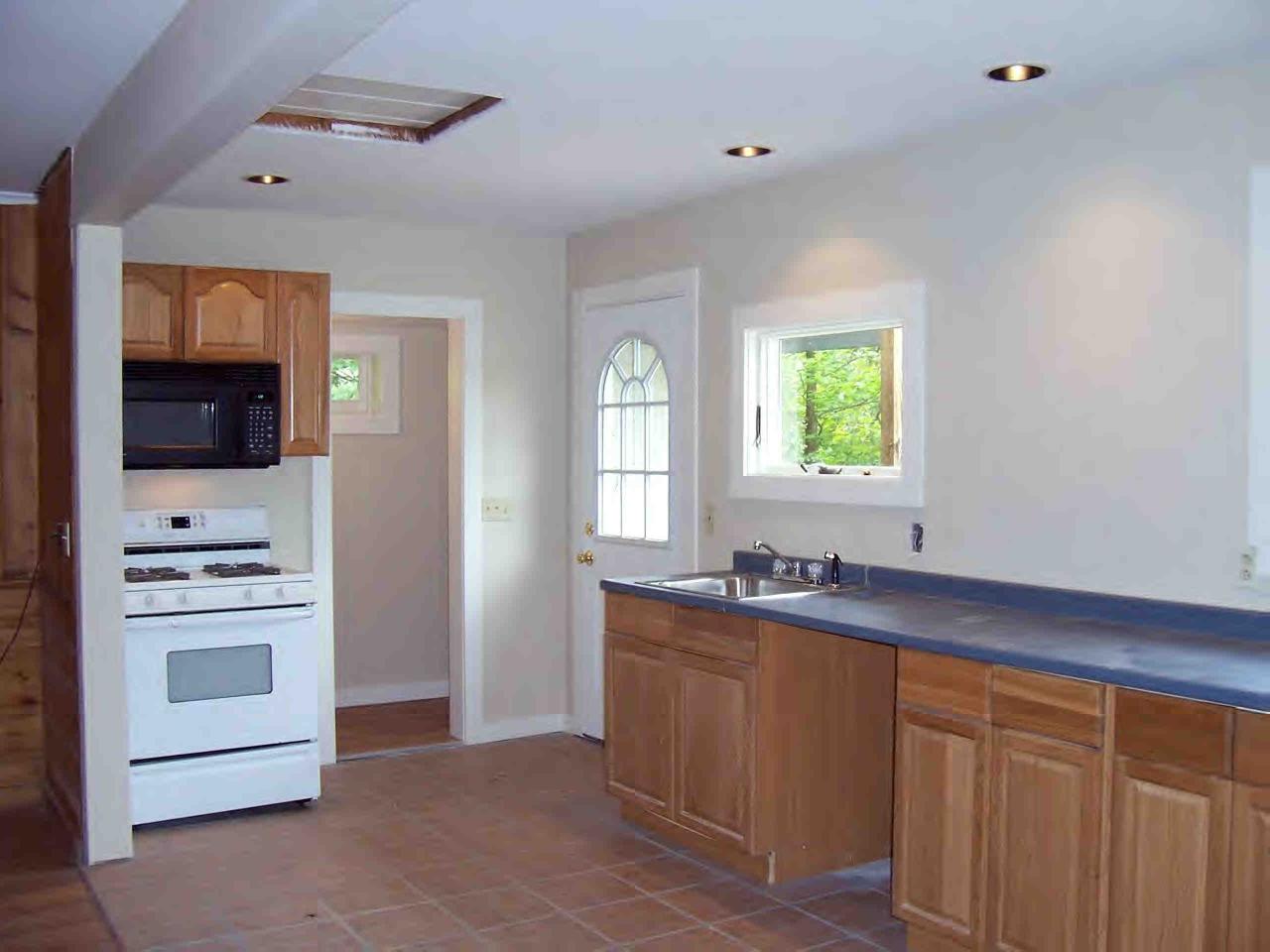 48 Access Road Windsor, MA 01270 - Photo 3 of 8 a kitchen with granite countertop a sink and cabinets