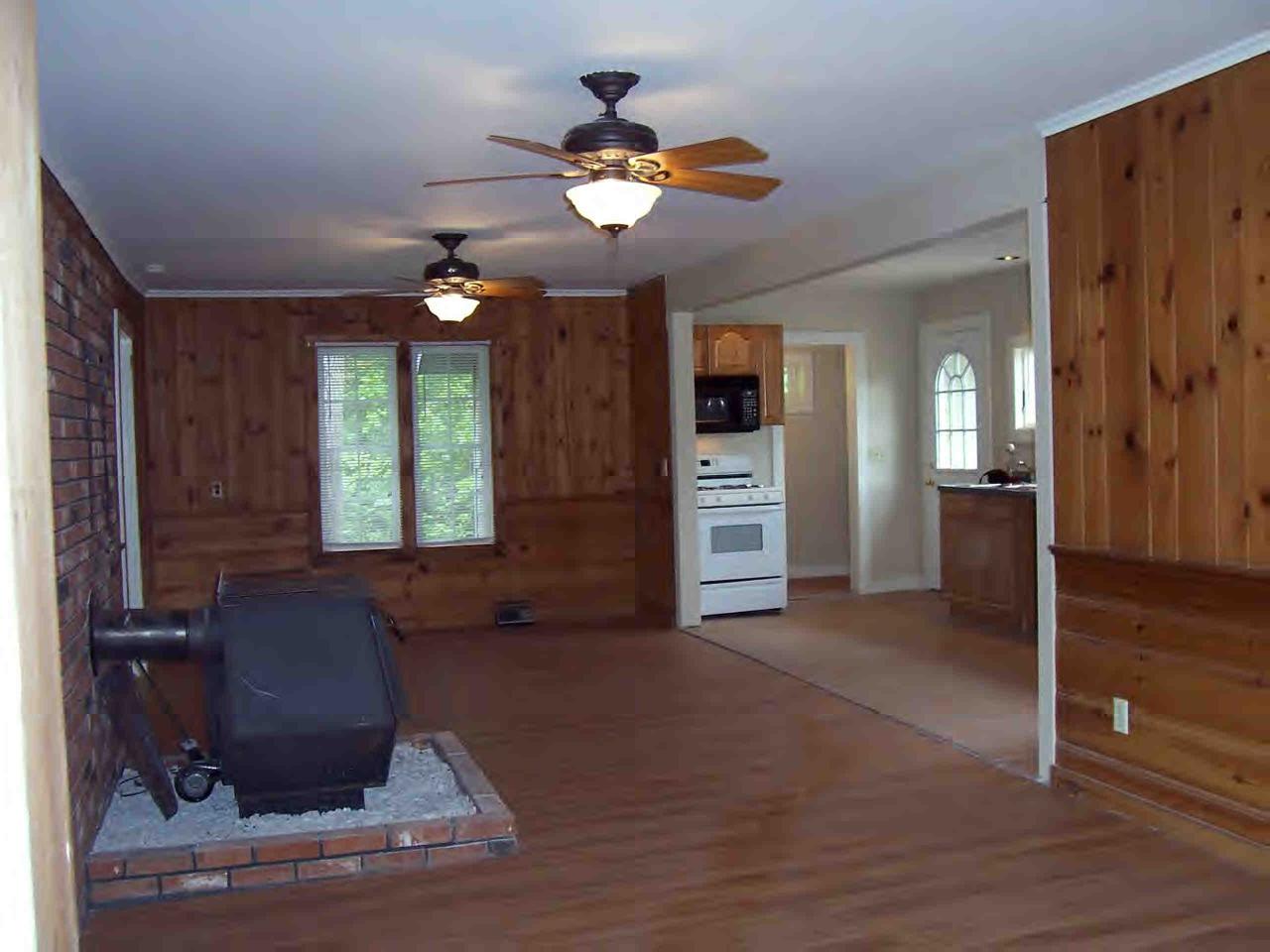 48 Access Road Windsor, MA 01270 - Photo 4 of 8 a living room with furniture and a chandelier