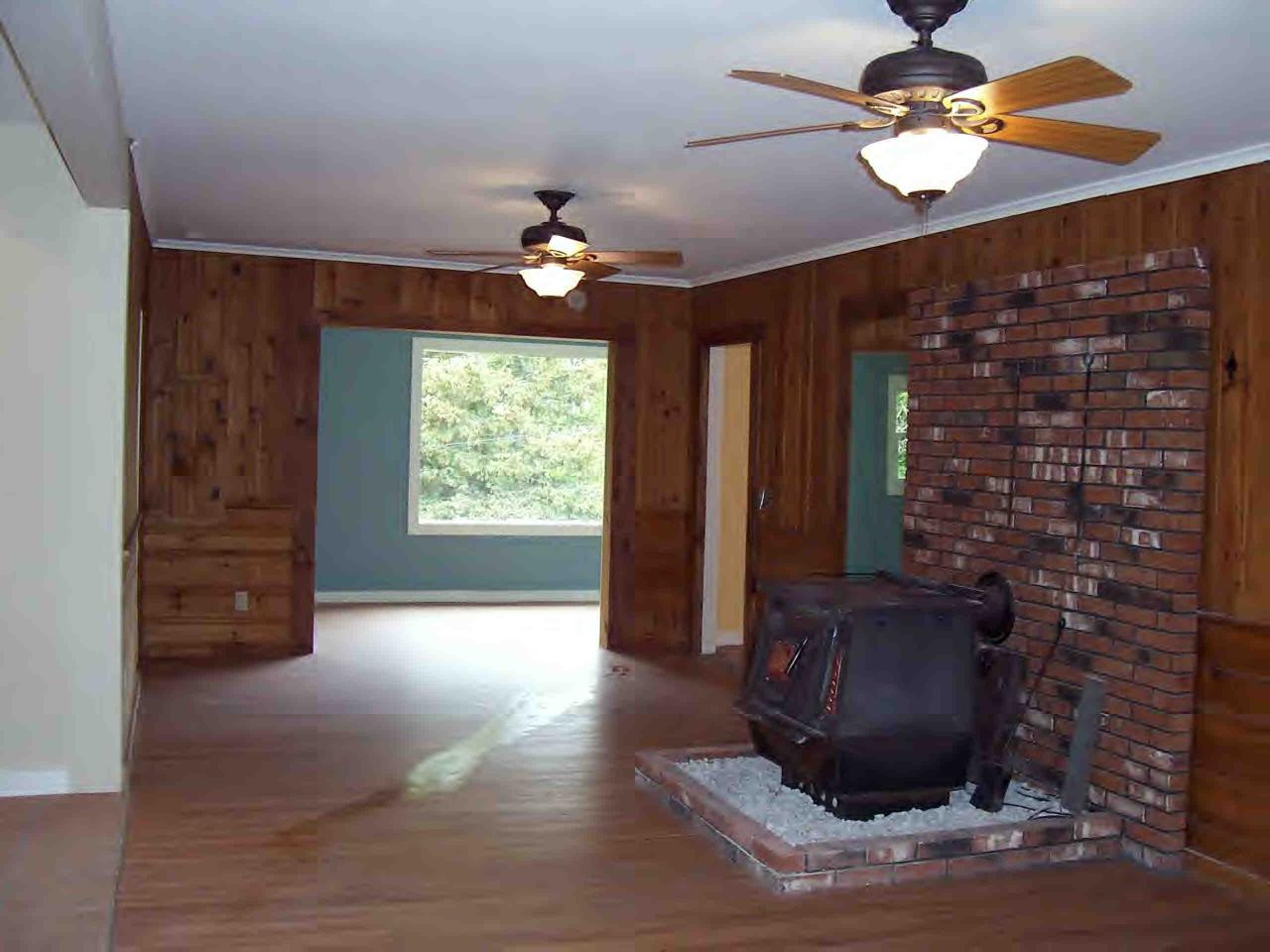 48 Access Road Windsor, MA 01270 - Photo 5 of 8 a view of a livingroom with a ceiling fan and window
