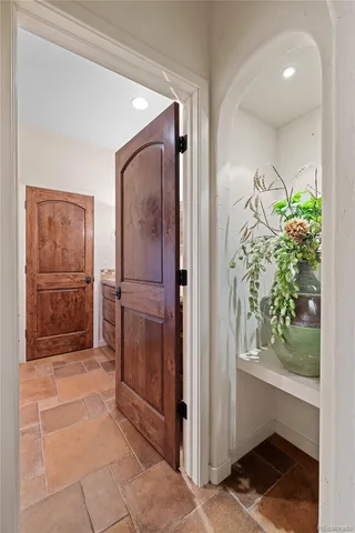 a view of entryway with window and front door