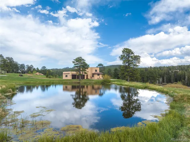 a view of a lake with houses in the back