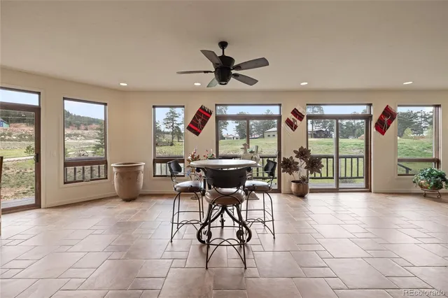 a view of a livingroom with furniture window and a chandelier