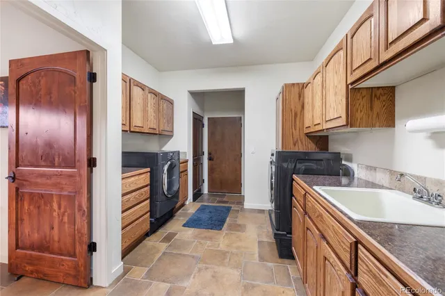 a kitchen with a sink stove and refrigerator