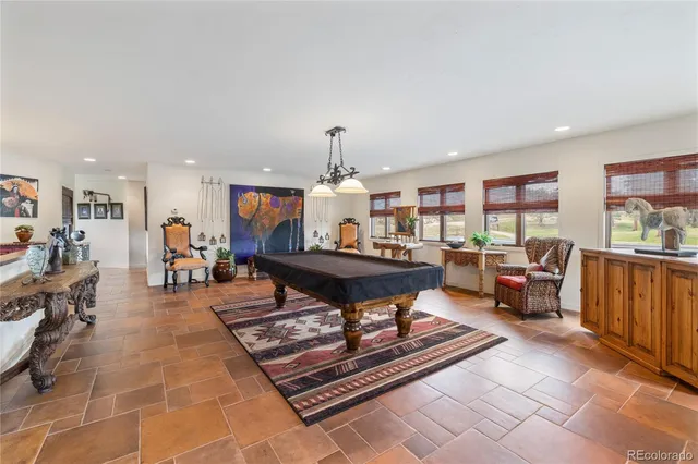 a living room with lots of furniture and a table