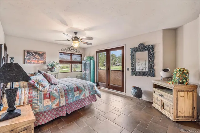 a bed room with a bed and a chandelier