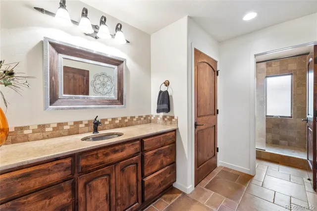 a bathroom with a sink and a mirror