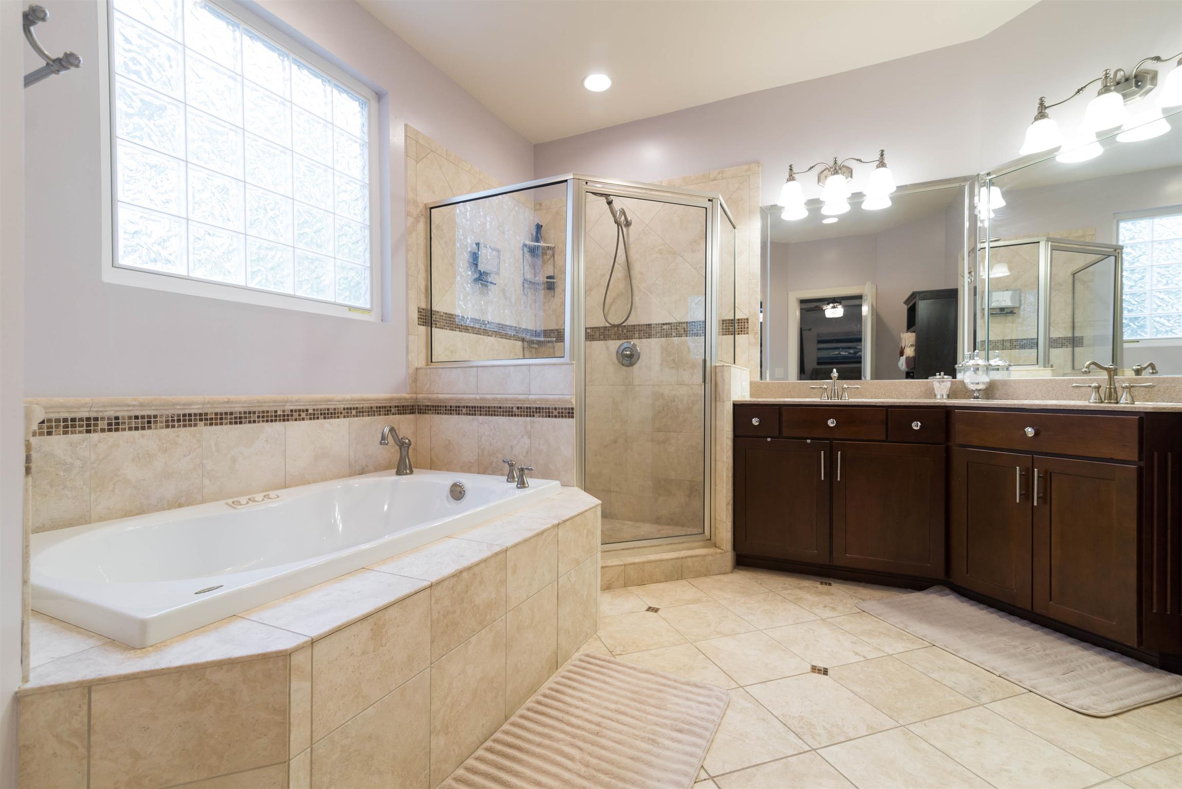 623 Tulip Grove Road Hermitage, TN 37076 - Photo 14 of 30 a spacious bathroom with a tub sink shower and mirror