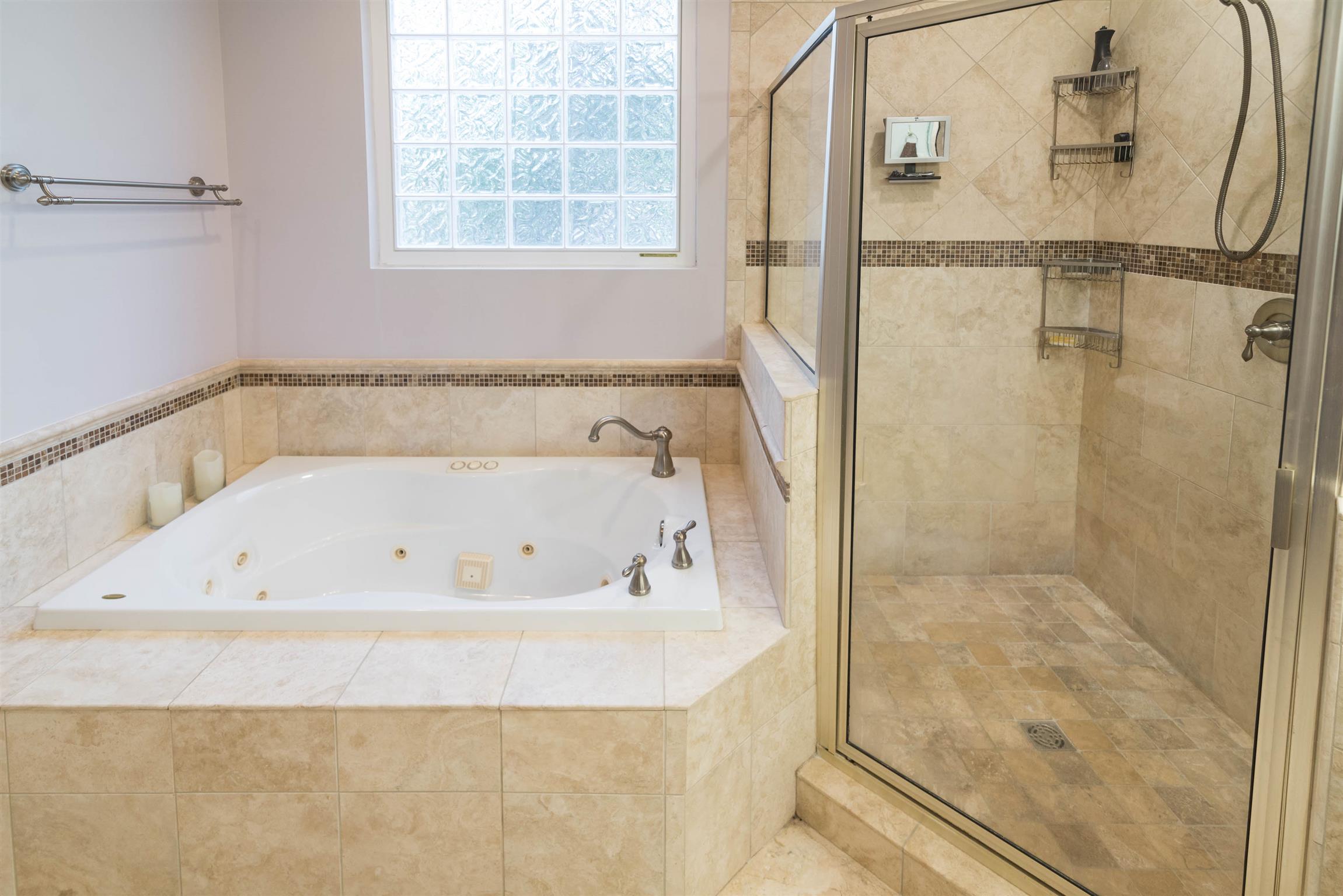 623 Tulip Grove Road Hermitage, TN 37076 - Photo 15 of 30 a bathroom with a bathtub and a shower