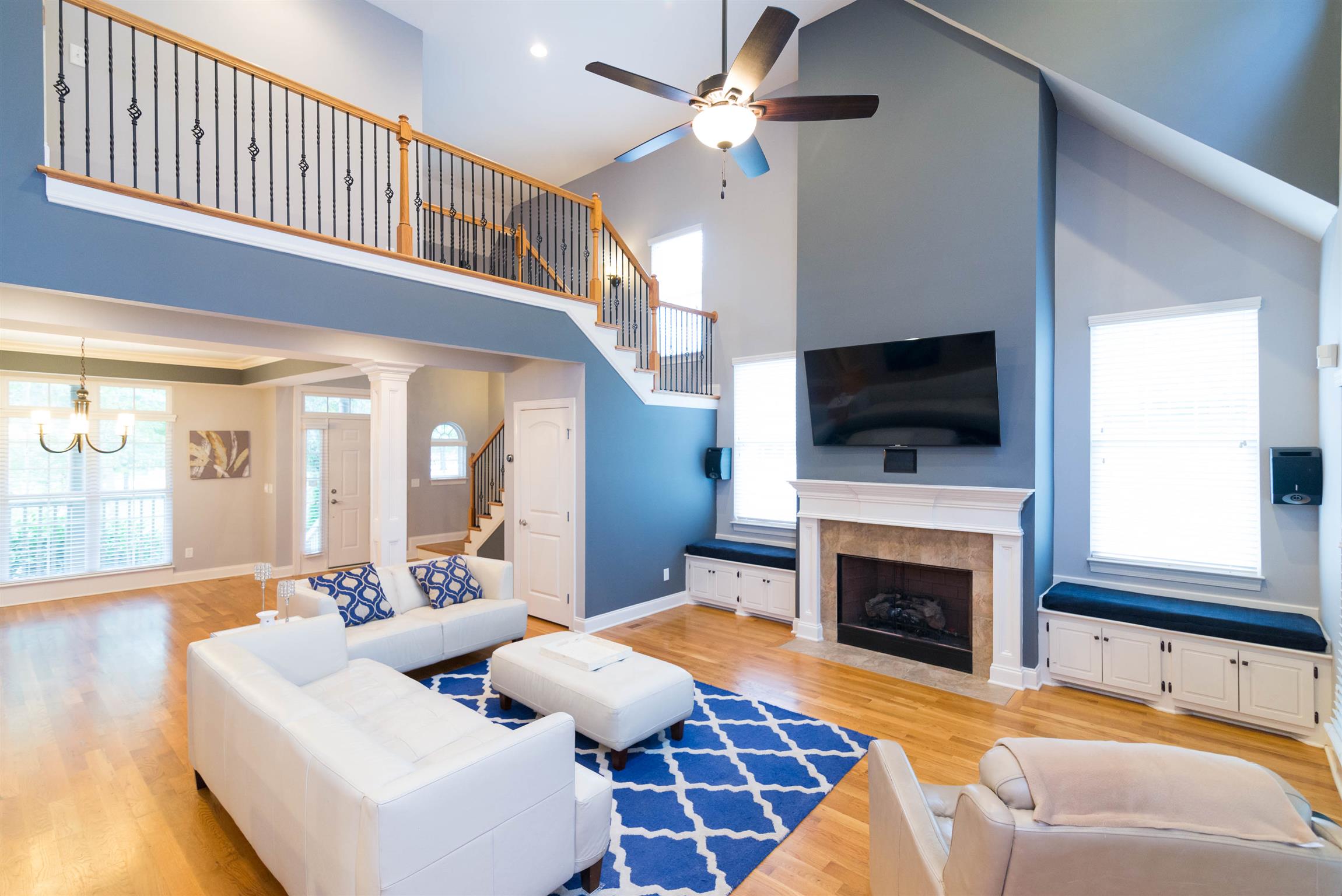623 Tulip Grove Road Hermitage, TN 37076 - Photo 4 of 30 a living room with furniture a fireplace and a flat screen tv