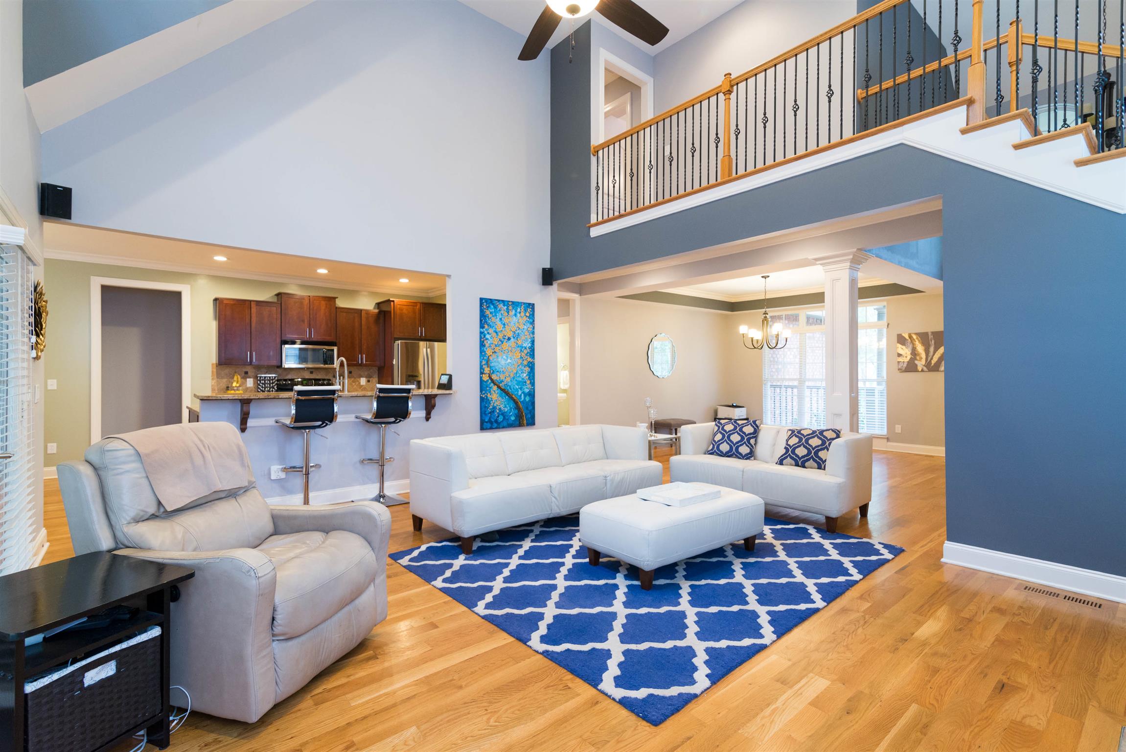 623 Tulip Grove Road Hermitage, TN 37076 - Photo 6 of 30 a living room with furniture a rug and a chandelier