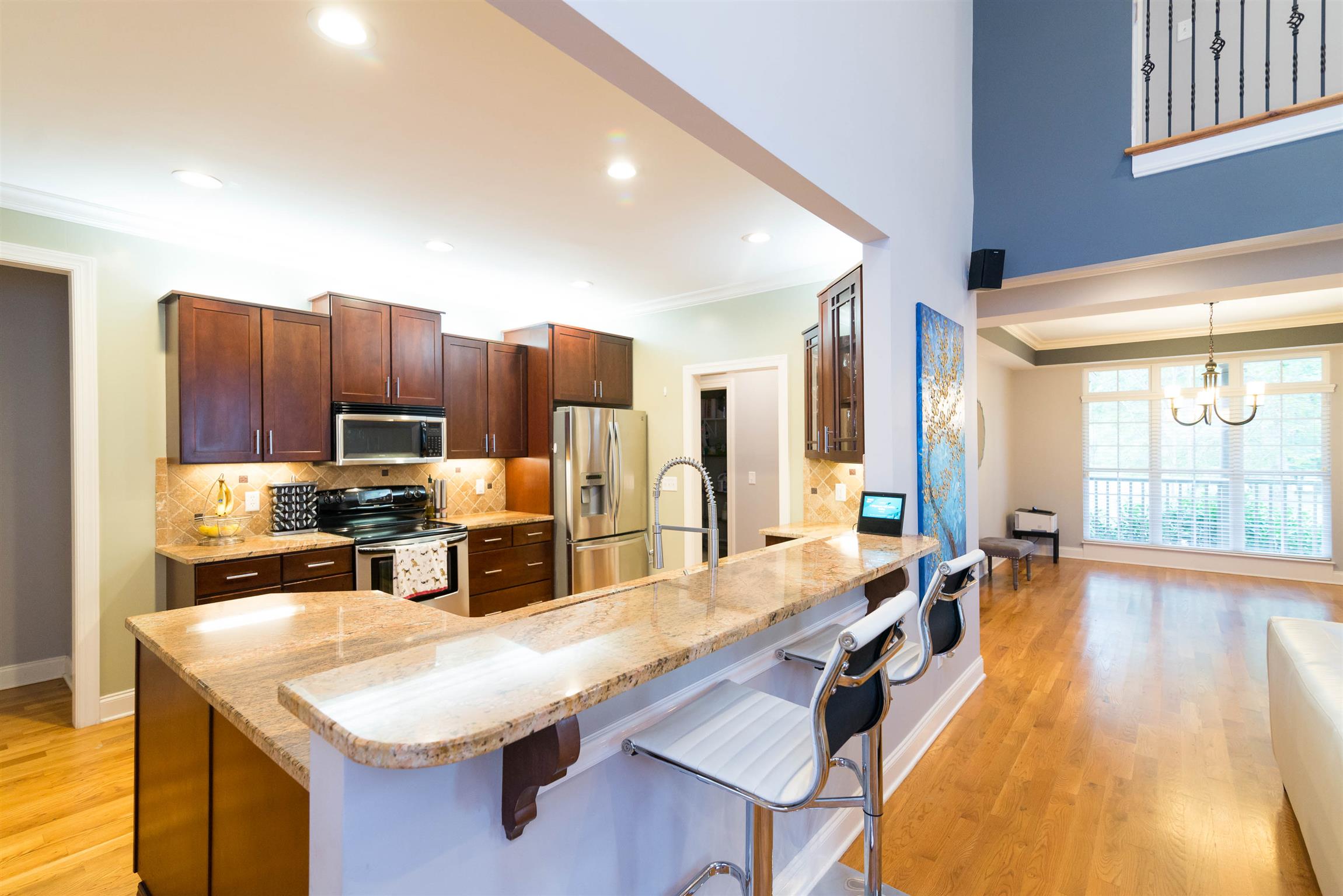623 Tulip Grove Road Hermitage, TN 37076 - Photo 7 of 30 a room with stainless steel appliances kitchen island granite countertop furniture and a kitchen view