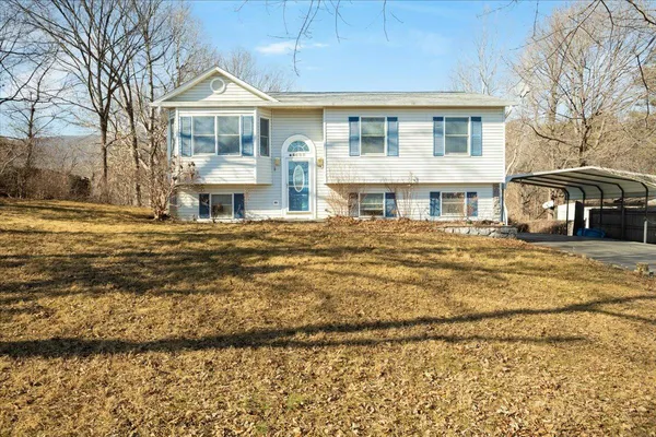 a front view of a house with a ocean view