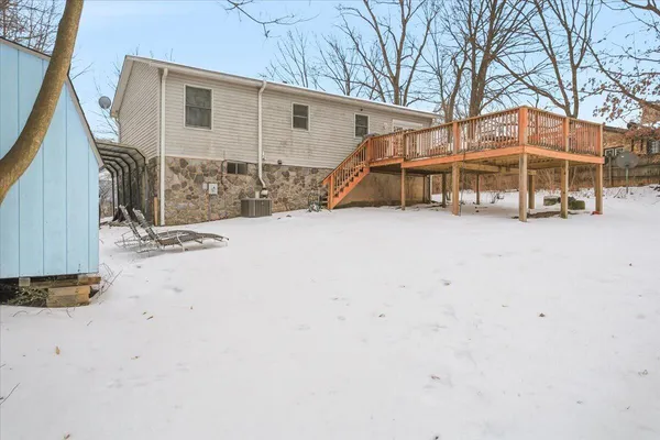 a view of a house with a wooden fence