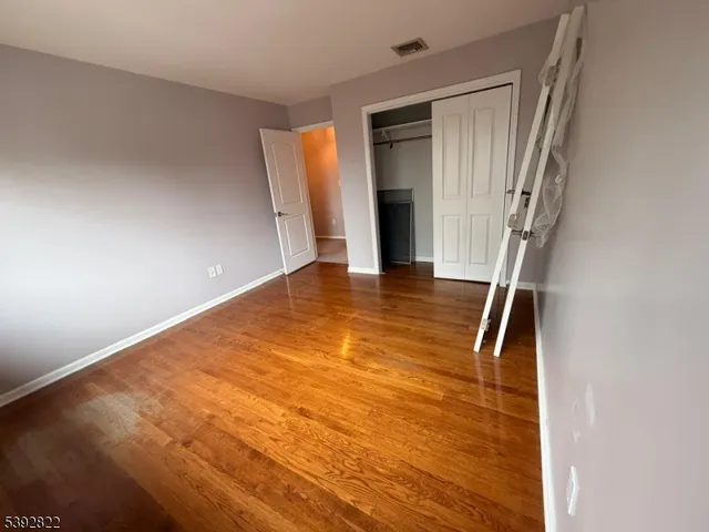 a view of an empty room with stairs