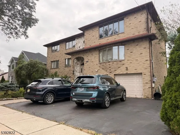 a view of a car parked in front of a house