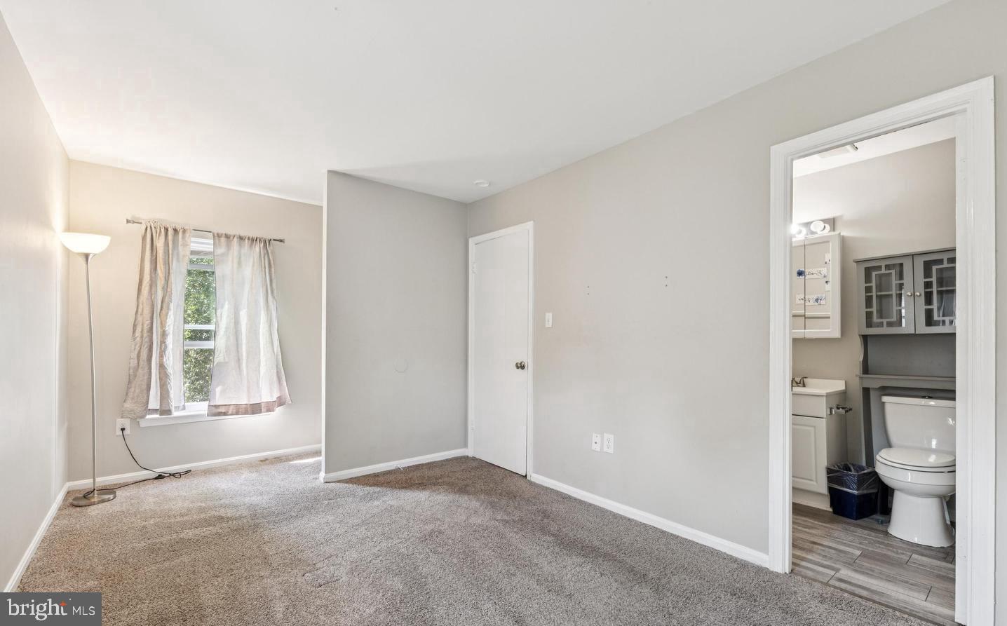 3059 Heath Cote Road Waldorf, MD 20602 - Photo 10 of 15 a view of an empty room with glass door and a window