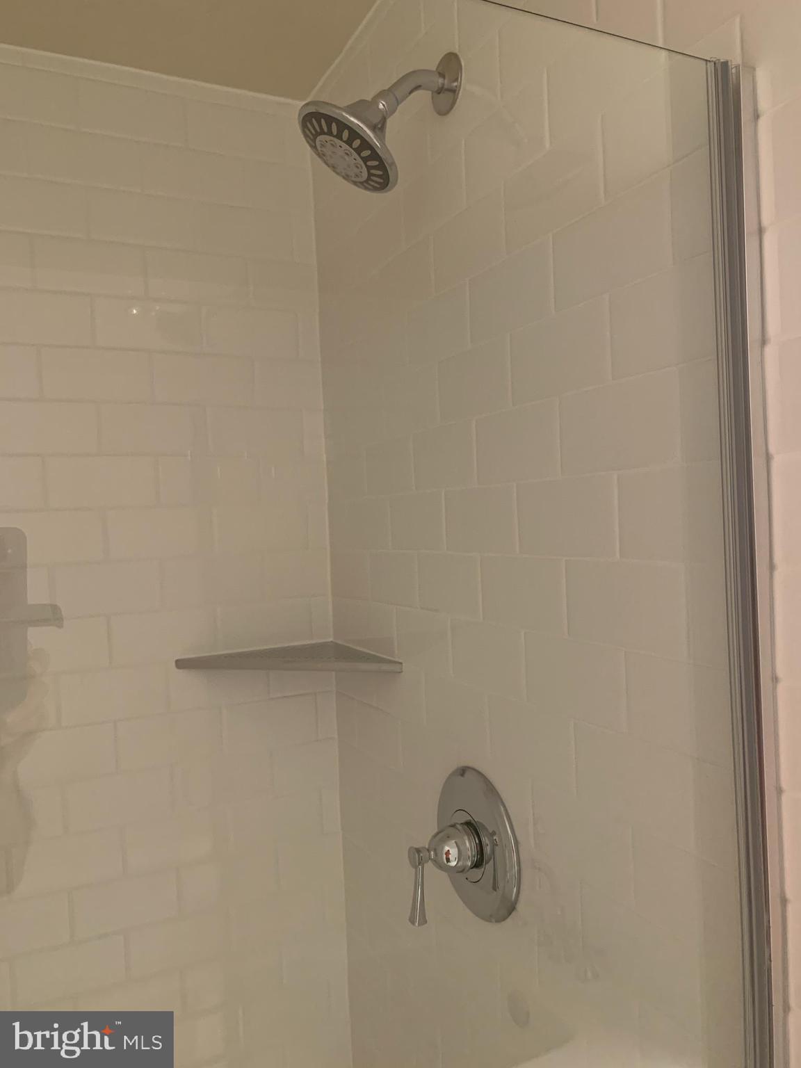 960 Fell Street, Unit 504 Baltimore, MD 21231 - Photo 11 of 32 a bathroom with a shower