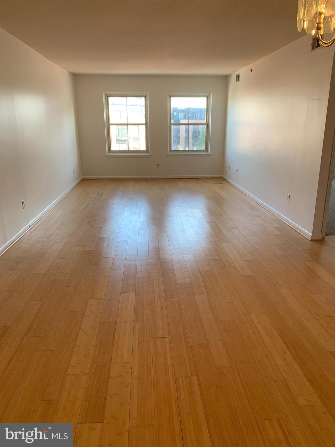 960 Fell Street, Unit 504 Baltimore, MD 21231 - Photo 15 of 32 an empty room with windows and fireplace