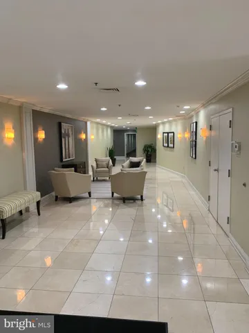 a lobby with a furniture and window