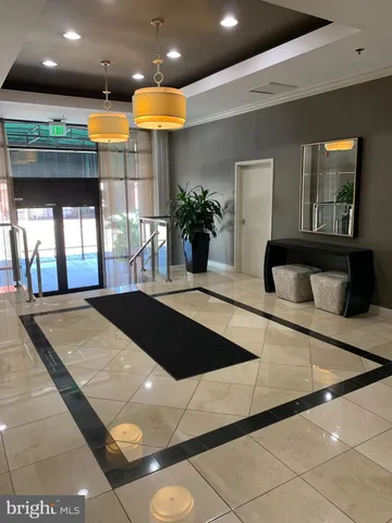 a view of a living room and entryway